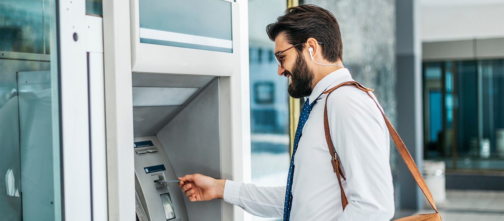 man at an ATM