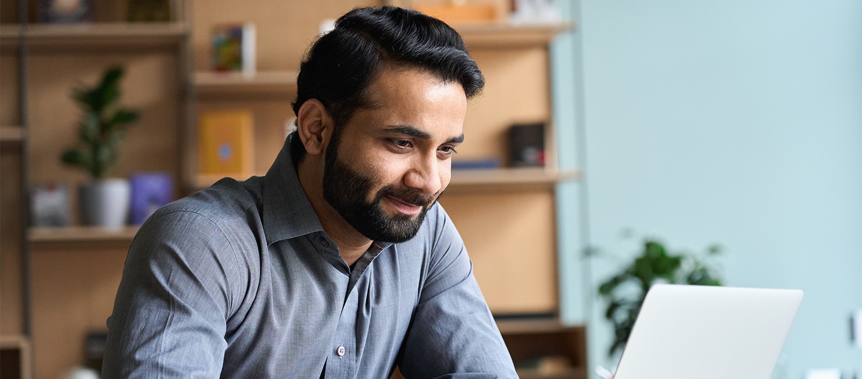 man on laptop in home office