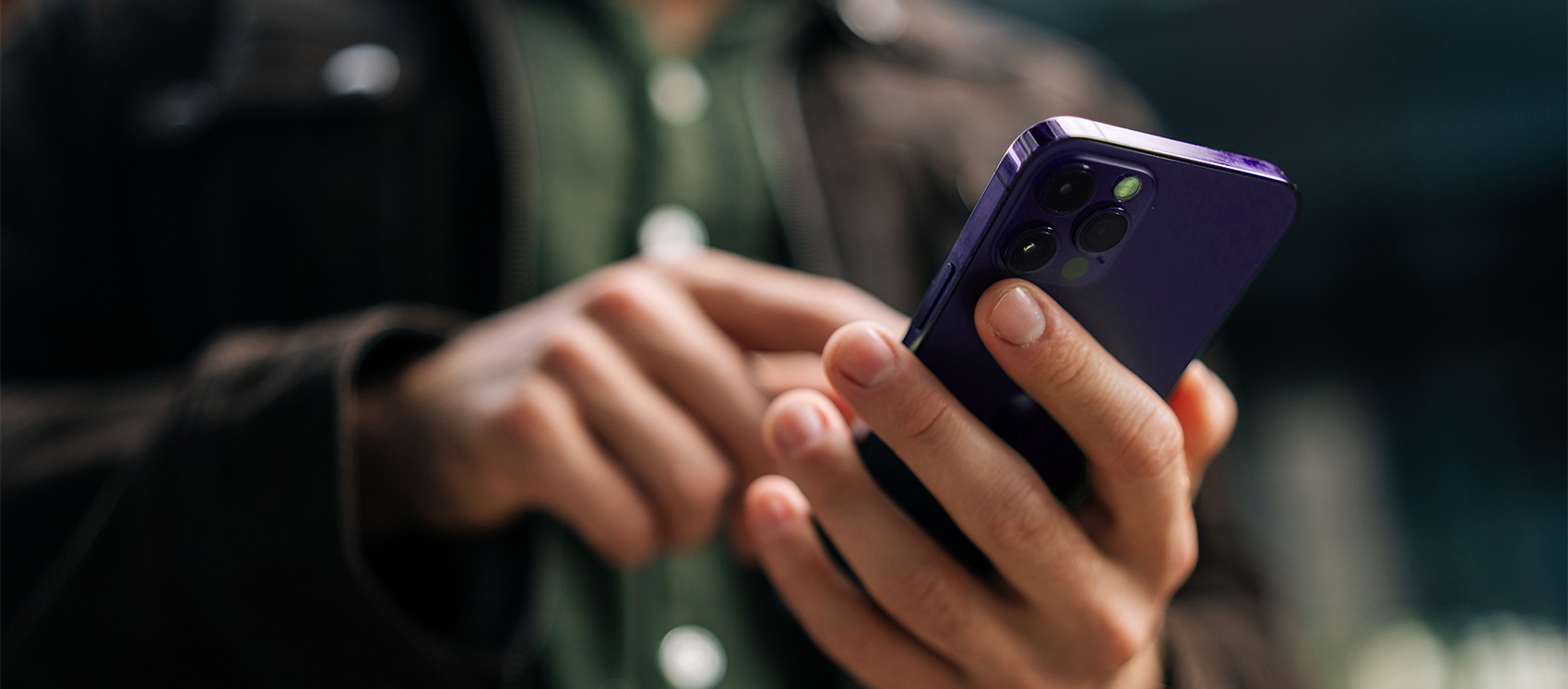 man with a purple mobile phone